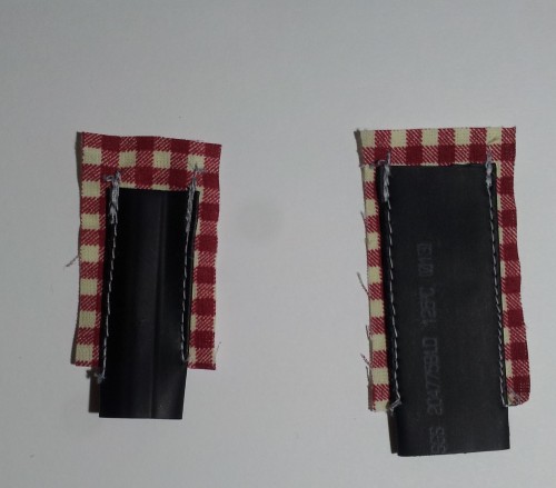 Shrinkable sleeves sewed to a cloth