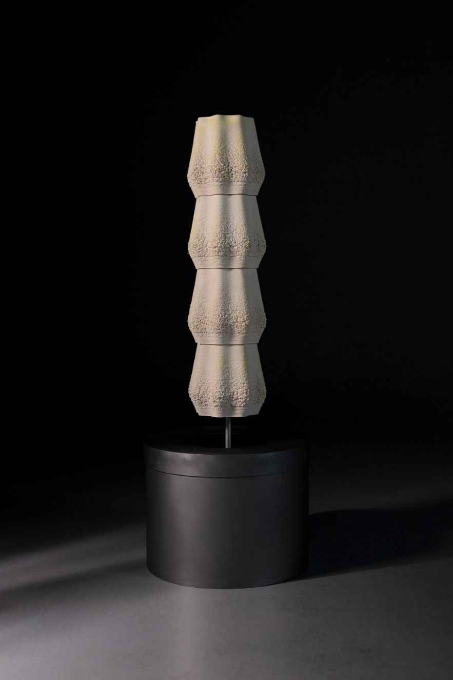ceramic-printed sculpture on a cylindrical base