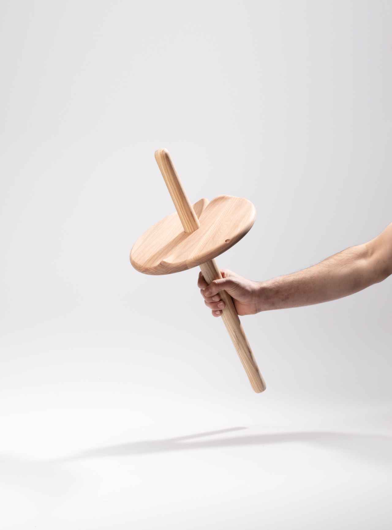 assembled circular seat plate and wooden pole, creating a seat