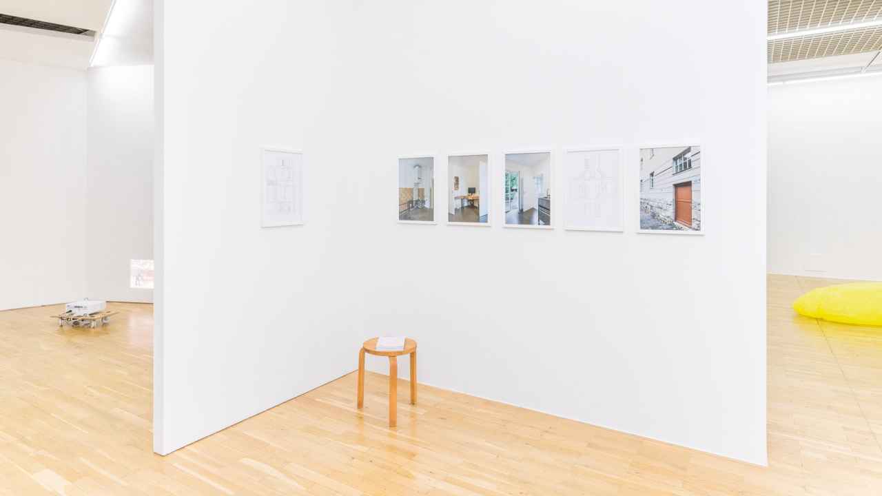 exhibition setup, 6 picture frames, 2 with line drawing, 4 with photographs