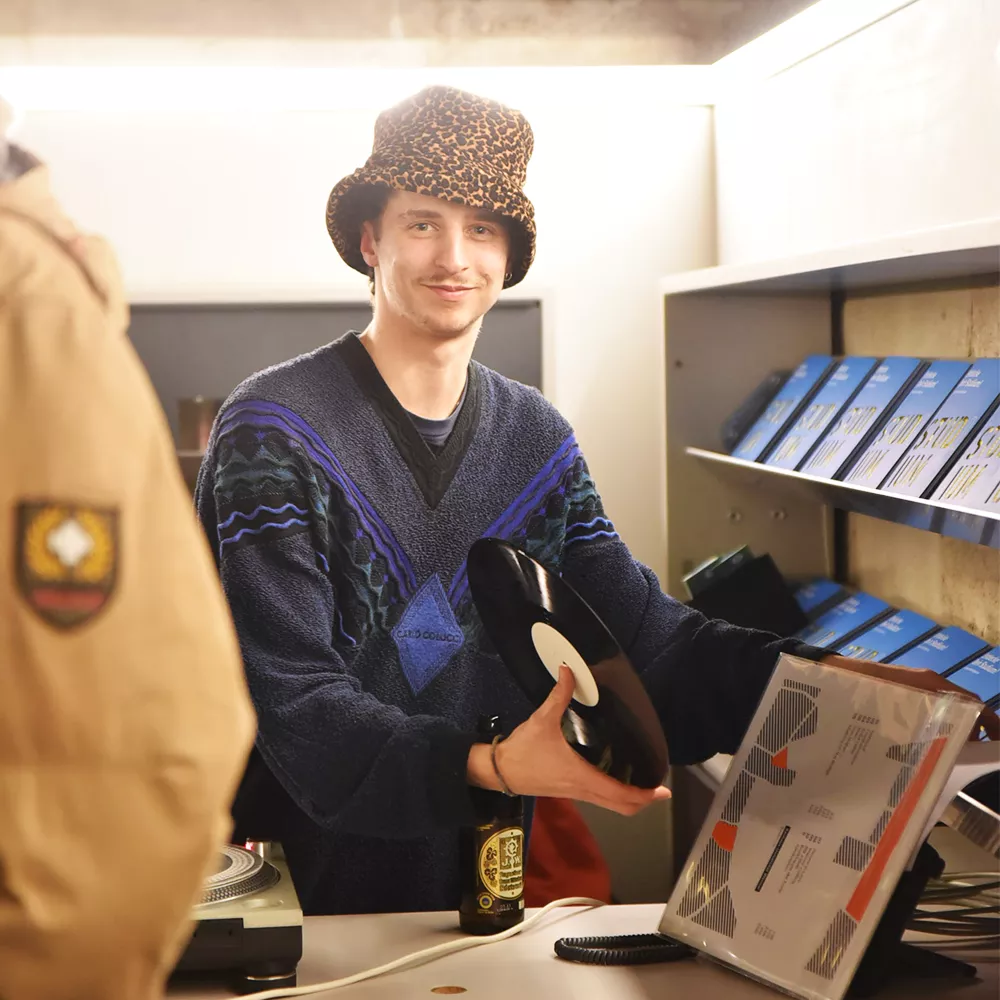 an individual unpacking a record
