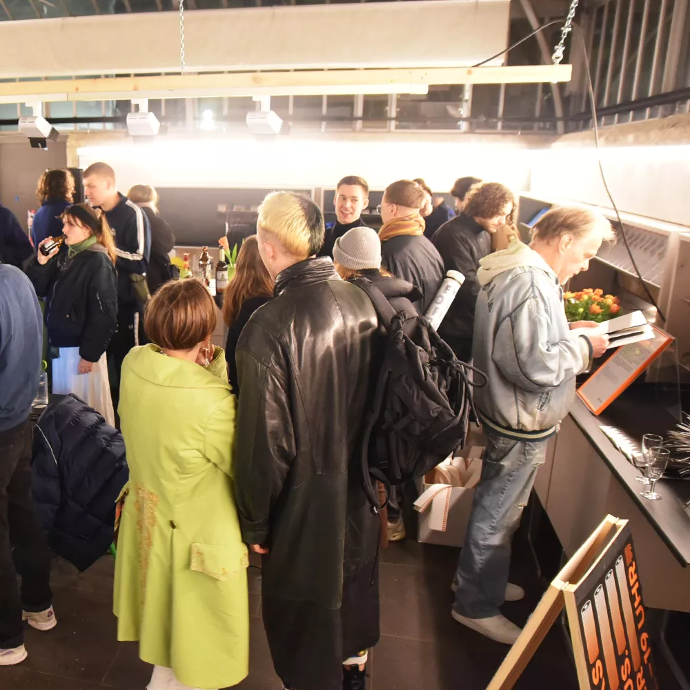 exhibition space crowded with visitors