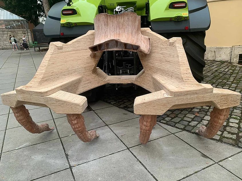Wooden plough by Jakob Elias Meyer, mounted on a tractor on the Bauhaus-Universität Weimar campus.