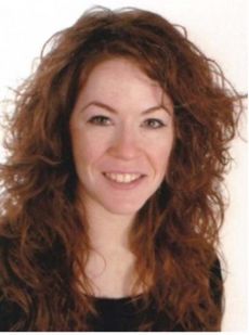 Porträtfoto von Dr. Isabel Vila Cabanes. Sie hat lange, lockige, rötliche Haare, grüne Augen und trägt einen schwarzen Pullover. Sie lächelt freundlich in die Kamera.