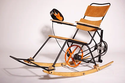 Photo of an object that is both a rocking chair and a bicycle