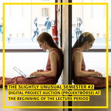 A student leaning against a wall looking at her laptop