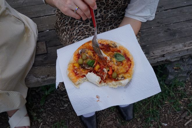 A person is eating pizza.