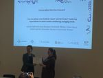 Tanja Döring (another old friend of our group) handing over the Honorable Mention certificate