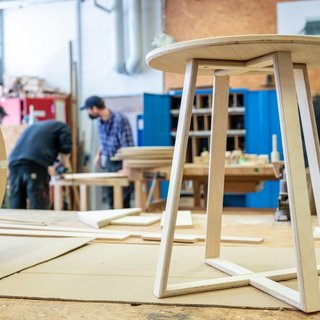 One of the stools A student works with mouthscOne of the stools for the foyer of the refectory is already finished and stands in the wood workshopt of the Faculty of Art and Design. Bauhaus-Universität Weimar, Photo: Thomas Müller
