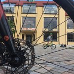 Bicycle spokes, in the background the main building of the university 
