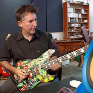 Warrick Swinney with an electric guitar