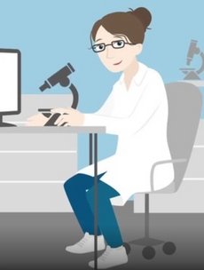 The video still shows a picture of Hanna, the protagonist of the BMBF's video. Hanna hast brown hair, which she wears in a bun, glasses and is wearing a white lab coat. She is sitting by a table with a microscope and smiles at the viewer.