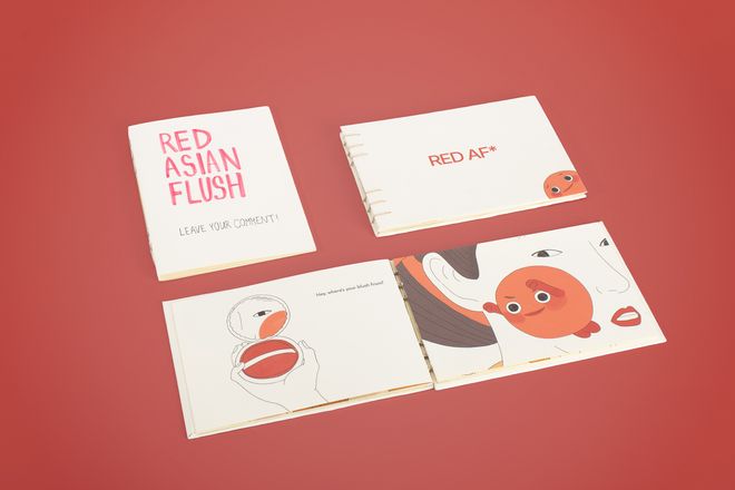 Product view of »RED AF* – Red Asian Flush« by Soo Ah Youn and Anastasia Fast: several books lie on a red background. An open book shows illustrations about the physical reaction known as »Asian Flush«.