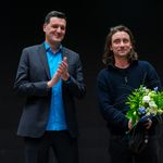 From left to right: Prof Peter Benz and Pio Rahner, holding a bouquet of flowers