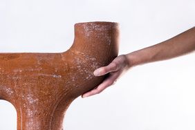 Detail of the seating furniture with hand 