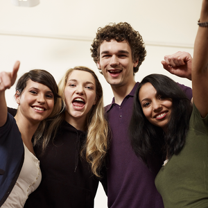 four smiling international students