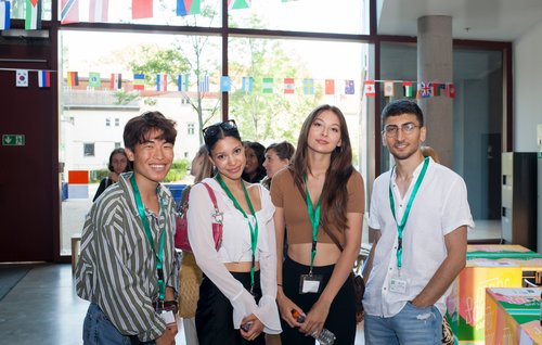Four international students at the University Library. Photo: Carlos Santos