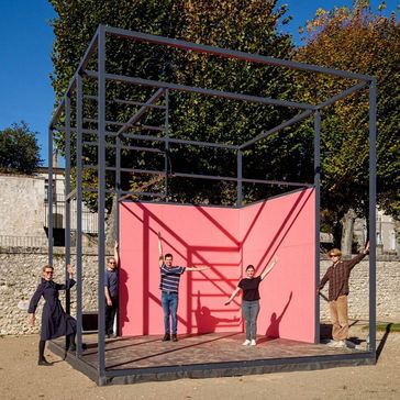 Participants of the project stand in the Gropius Room Pavilion