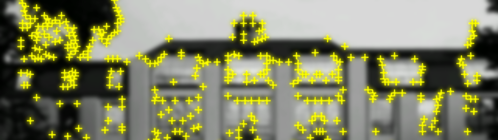 Analysis of the image of the Bauhaus main building displaying a contrast based features of the image that are visible to camera Image target with yellow crosses of the image of the bauhaus main building. It displays a contrast based features of the image that are visible to camera.