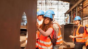 Students during excursion in the steelworks, student take a close look at steel